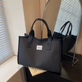 Classic black and white checkered tote bag with wide textile handles for daily commuting - Black