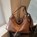 Minimalist large brown tote bag in glossy faux leather with decorative buckle straps - Brown