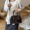 Dark brown suede Boston bag with gold logo and fluffy charm pendant for women - Brown