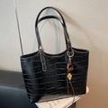 Black crocodile embossed tote bag with adjustable straps and a plush pompom charm - Black (With Charm)