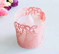 Detail of pink laser-cut lace paper tea light wraps with LED candles for party decor - Pink