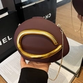 Deep burgundy irregular evening clutch with unique gold metal handle and chain strap - Brown