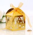 Golden Christmas laser-cut candy box with snowflake patterns and yellow organza ribbon - Reflective Gold