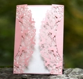 Elegant pink laser-cut floral butterfly wedding invitation on a natural wooden base - Pink
