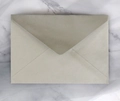 Champagne metallic pearl paper envelope with V-flap design on marble and white veil - Rectangular Silver Gray