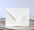 Macro detail of high-quality thick white rectangular envelope on decorative plate - Small Rectangular White