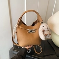 Caramel lychee leather bucket bag with bow metal buckle and cute white bunny charm - Light Brown With Charm