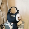 Chic black leather bucket bag with silver bow clasp and white rabbit plush charm accessory - Black with Pendant