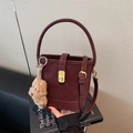 Retro burgundy bucket bag with suede texture, top handle, and cute bear charm - Wine Red With Pendant