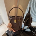 Dark brown suede bucket bag with round handle, gold lock and cute plush bear charm - Coffee with Pendant