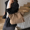Minimalist large khaki tote bag made of matte leather with silver eyelet details - Brown