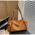 Detail of vintage brown suede shoulder bag with adjustable leather strap and gold buckle - Brown