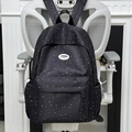 Black school backpack with white starry polka dot patterns and front zip pocket - Black (Without Charm)