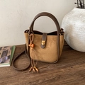 Close-up of retro brown suede tote bag with leather straps and decorative wooden beads - Suede Brown (JC-1293)