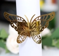Close-up of golden hollow butterfly napkin ring with laser-cut wing details for weddings - Reflective Gold