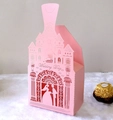 Detail of laser-cut pink wedding favor box with castle silhouette and romantic engraving - Pink