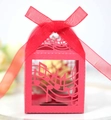 Macro detail of red laser-cut candy box featuring musical notes and a matching organza bow - Pearlescent Red