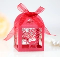 Detail of red laser-cut Christmas favor box with reindeer snowflake design and ribbon - Pearlescent Red