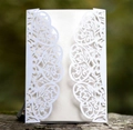 Detailed laser-cut intricate vine patterns on white wedding invitation card - Ivory