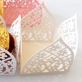 Laser cut floral hollow candy box wrappers in white, pink, and yellow colors - Ivory