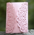 Detail showing laser-cut floral patterns on pink pearlescent invitation card cover - Pink