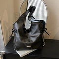 Large black faux leather hobo tote bag with silver metal plate and side bow drawstring - Black