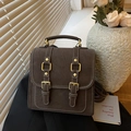 Donkerbruine vintage rugzak met contrasterende stiksels en gouden gespen - Bruin