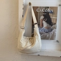 Minimalist beige canvas dumpling bag with dual front zippers and adjustable wide strap - White