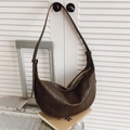 Deep brown vintage leather hobo bag with a grainy texture and adjustable gold hardware - Brown