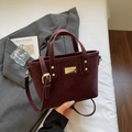 Deep burgundy frosted bucket bag with gold logo and detachable strap on grey blazer - Wine Red Without Pendant