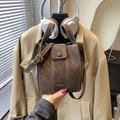 Brown faux suede bucket bag with white contrast stitching and adjustable crossbody strap - Brown No Pendant