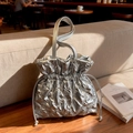 Silver quilted bucket bag with metallic finish and drawstring closure for women - Silver