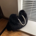 Minimalist black faux fur handbag featuring a decorative large white pearl chain strap - Black
