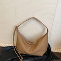 Brown leather moon-shaped crossbody tote bag with fine grain texture and zip closure - Brown