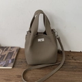 Taupe pebbled leather bucket bag with silver twist lock and adjustable crossbody strap - No Pendant / Elephant Gray