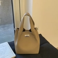 Chic beige lychee grain bucket bag with a silver swivel lock and a soft leather handle - No Pendant / Khaki