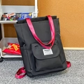 Zaino per studenti alla moda in contrasto nero e rosso con grande tasca frontale - Nero