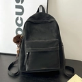 Retro black leather backpack with large front pocket and white stitching details - With Charm / Black