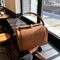 Vintage brown frosted leather barrel shoulder bag with golden buckle and top handle - Brown