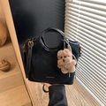 Retro black bucket shoulder bag with gold hardware and brown plush bear charm detail - Black with Pendant