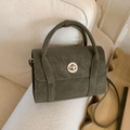 Deep olive green pebbled leather crossbody bag with silver round twist lock and top handle - Green