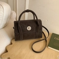 Vintage dark brown crossbody messenger bag with a silver round lock and top handles - Ebony