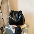 Retro black bucket bag in shiny leather with ethnic style wide woven shoulder strap - Black