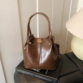 Retro dark brown bucket bag in oil wax leather with vintage pattern strap - Tan