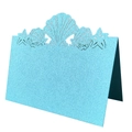 Macro detail of laser-cut seashells and starfish on light blue pearlescent place cards - Tiffany Blue