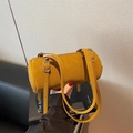 Retro mustard yellow cylinder bag with vintage leather texture and silver hardware - Brown