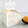 Detail of laser-cut floral lace patterns on an off-white crown candy gift box - Ivory