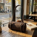 Brown matte suede cylinder pillow bag with adjustable straps and silver buckles - Brown