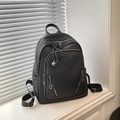 Black litchi-grain leather backpack with silver zippers and adjustable straps - Black