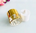 Christmas LED tea light with golden snowflake hollow metal sleeve and white candle base - Reflective Gold